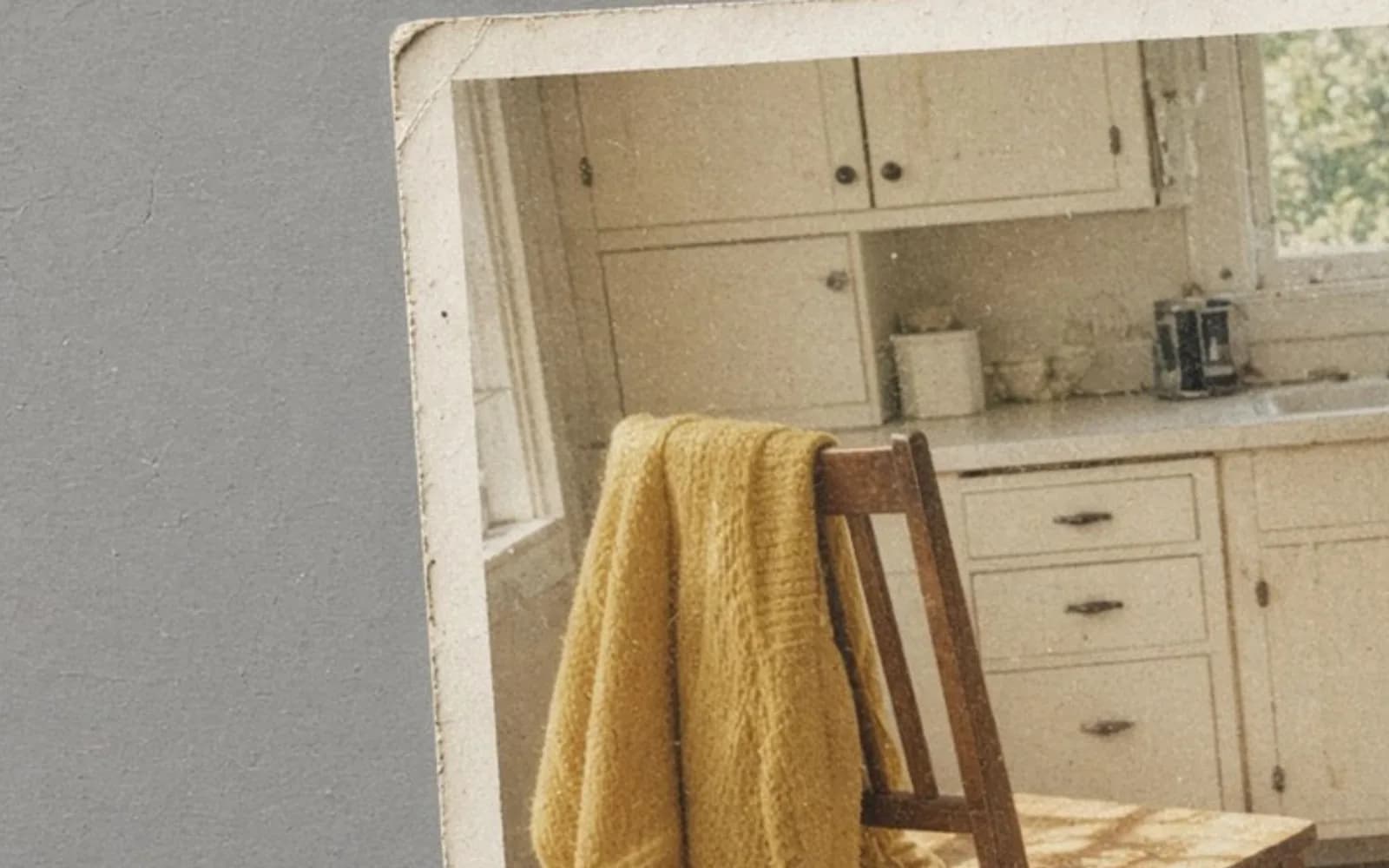 The same crop of a faded kitchen snapshot lying on a table without the age damage, kept for comparison.