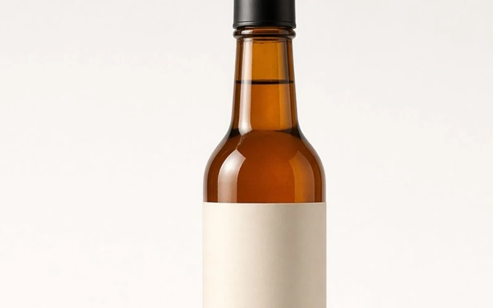 The same crop of an amber bottle on a white board without the haze damage, kept for comparison.