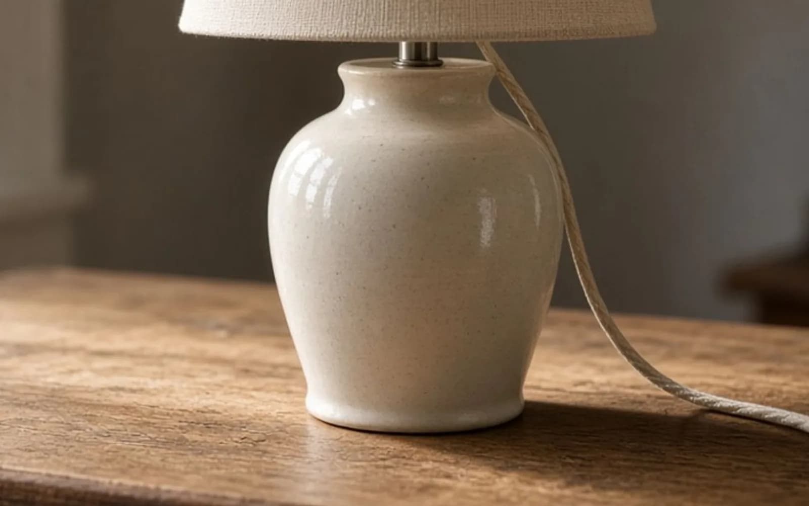 The same crop of a ceramic lamp on an oak desk without the pixel damage, kept for comparison.
